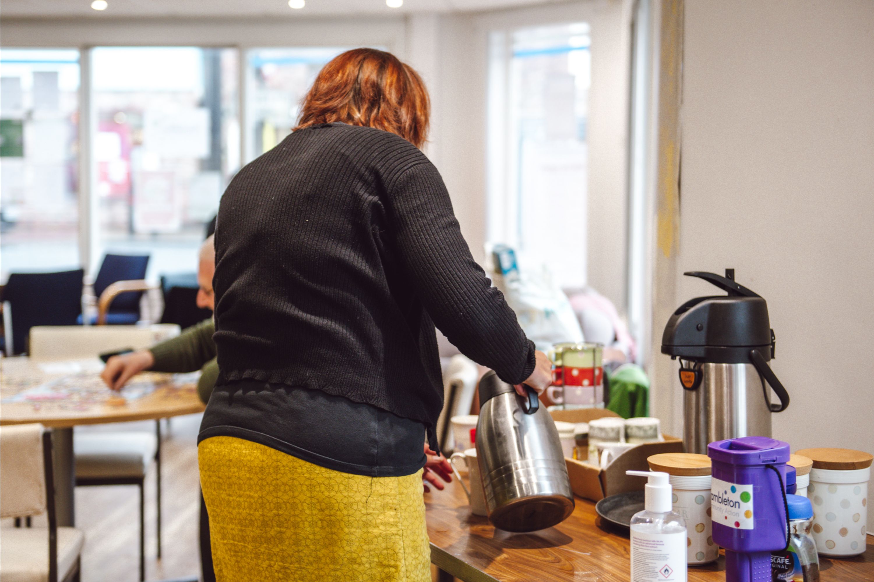 person making a hot drink 